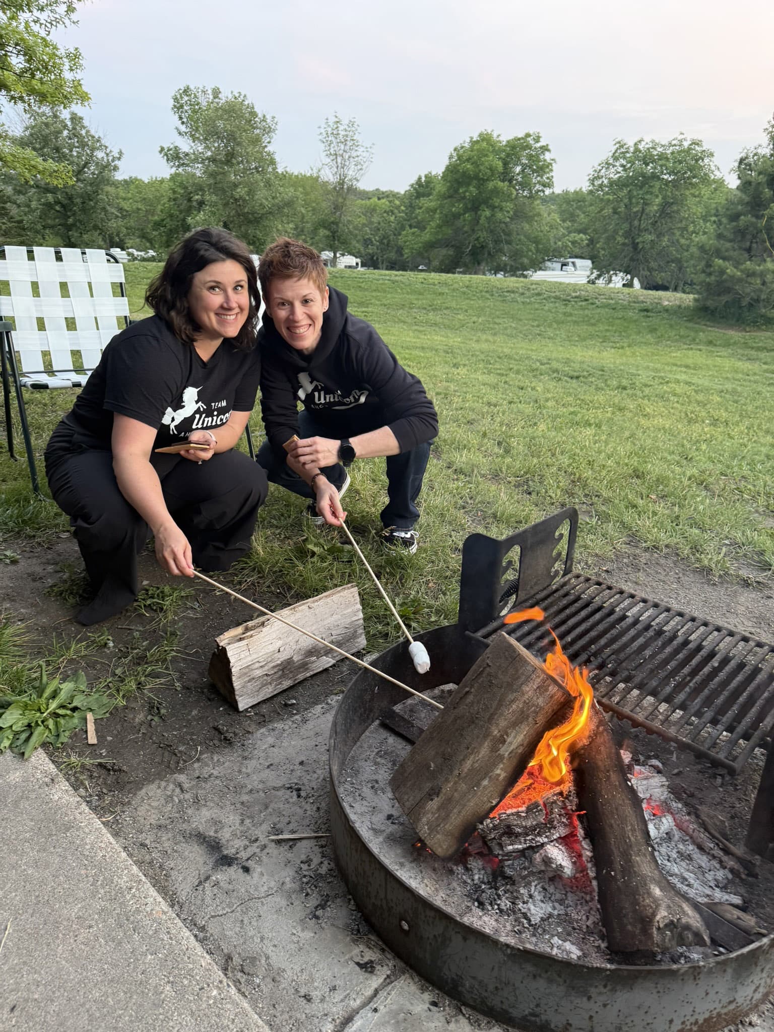ali-theresa-smores Ali and Theresa making s'mores.